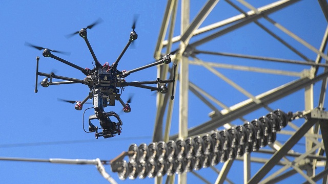 A drone recording something Flying Drone