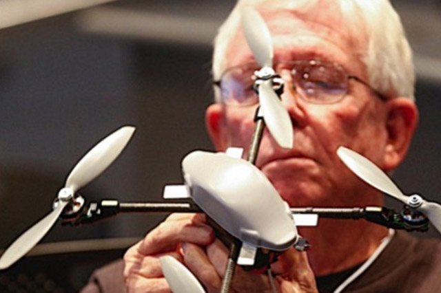 A Man Holding a Drone Unmanned Aerial Vehicle