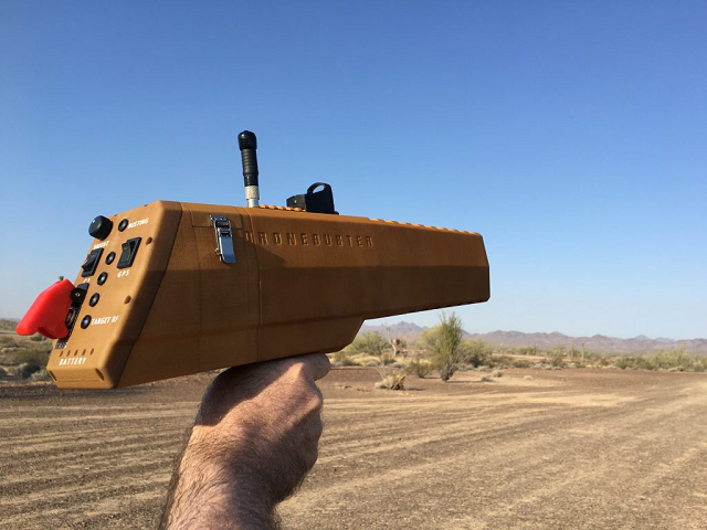He is holding a drone buster Drone Buster