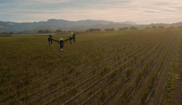 Flying drone in a field GPS Drone