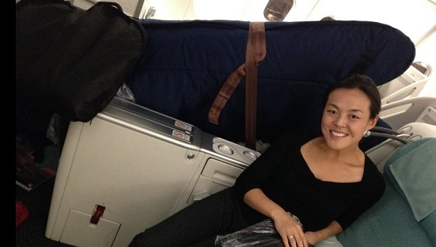 A woman on a flight with her cello Musical Instruments in Cabin