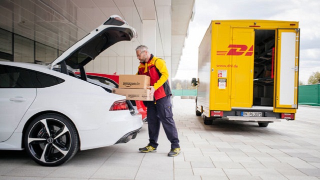 A delivery man putting a package in a car Deliver Items to Your Car Trunk