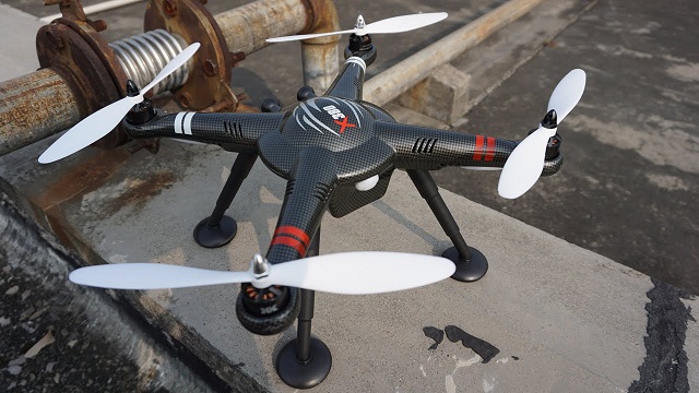 A black quadcopter drone XK Detect X380