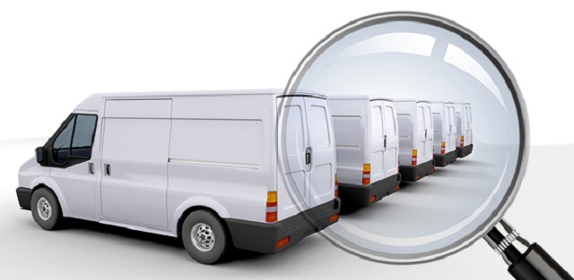 A row of cargo vans Monitoring Company Vehicles
