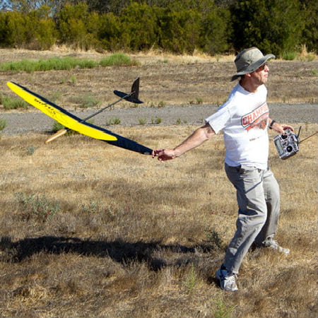 Man Trying to Fly a Toy Plane