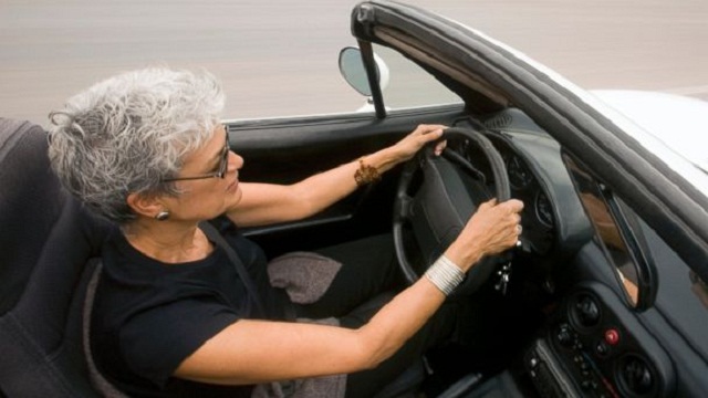An elderly is driving Elderly Driving