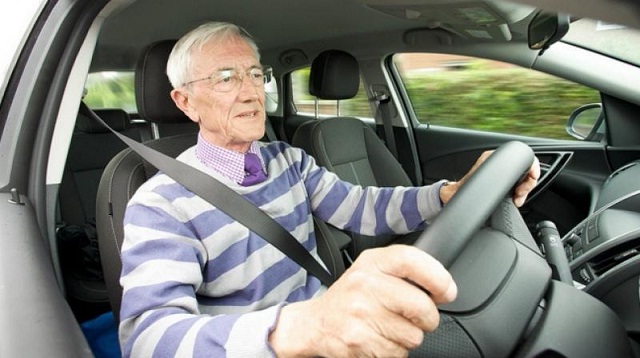 An old man driving Elderly Driver