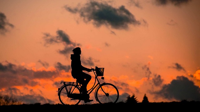 Silhouette of person riding a bike Riding a Bicycle
